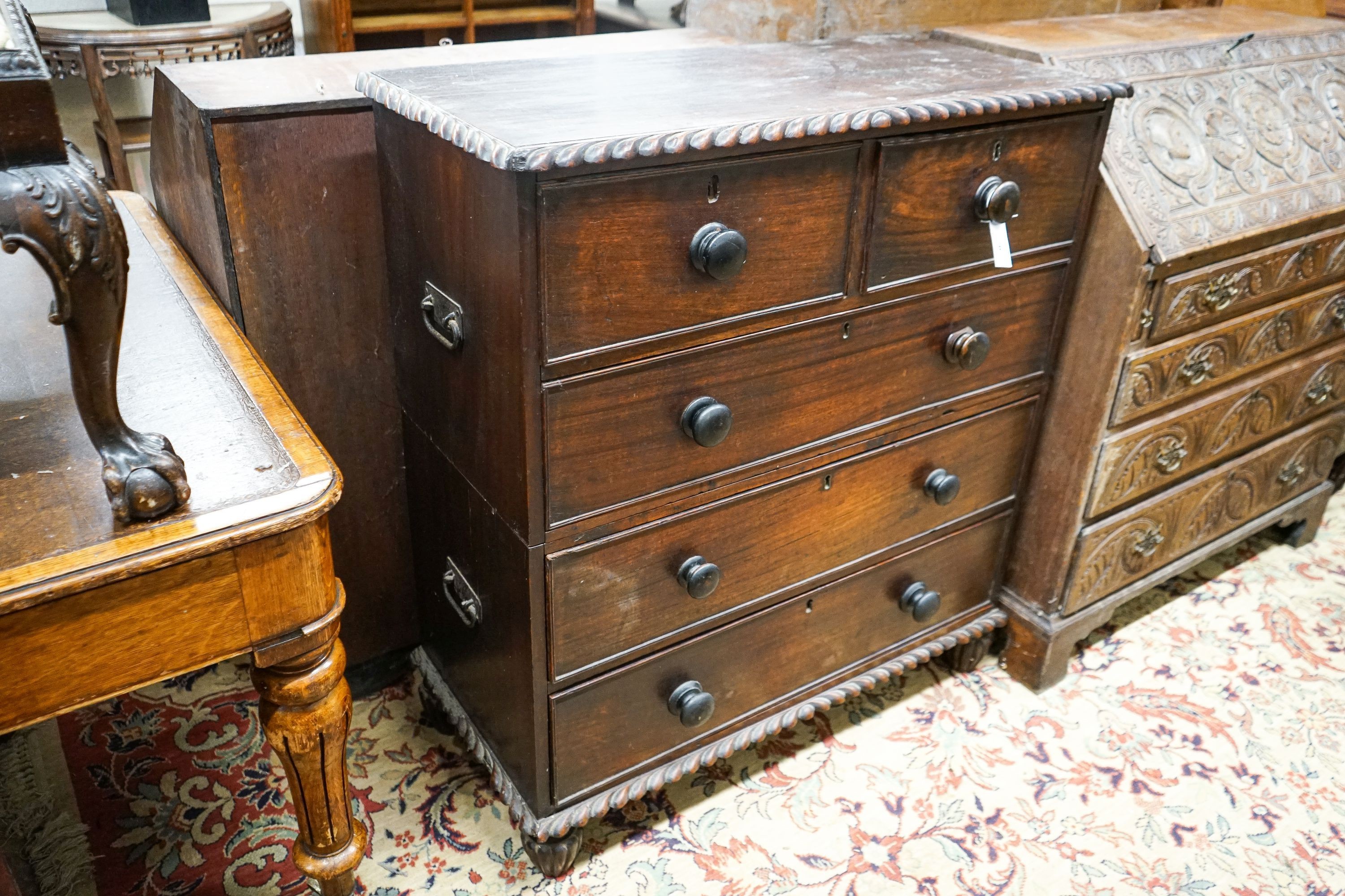 A 19th century Anglo Indian padouk two part chest with gadrooned decoration, width 96cm, depth 43cm, height 106cm